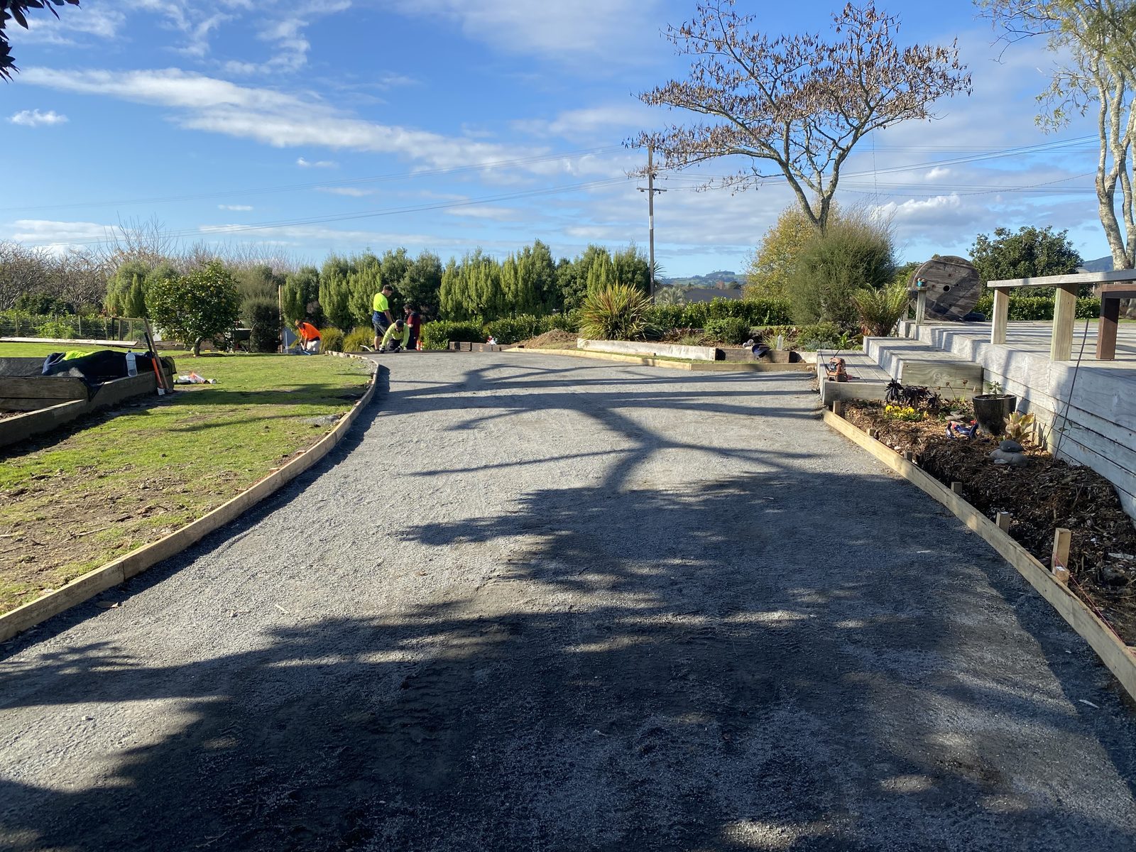 Block retaining wall with steel reinforcing in place